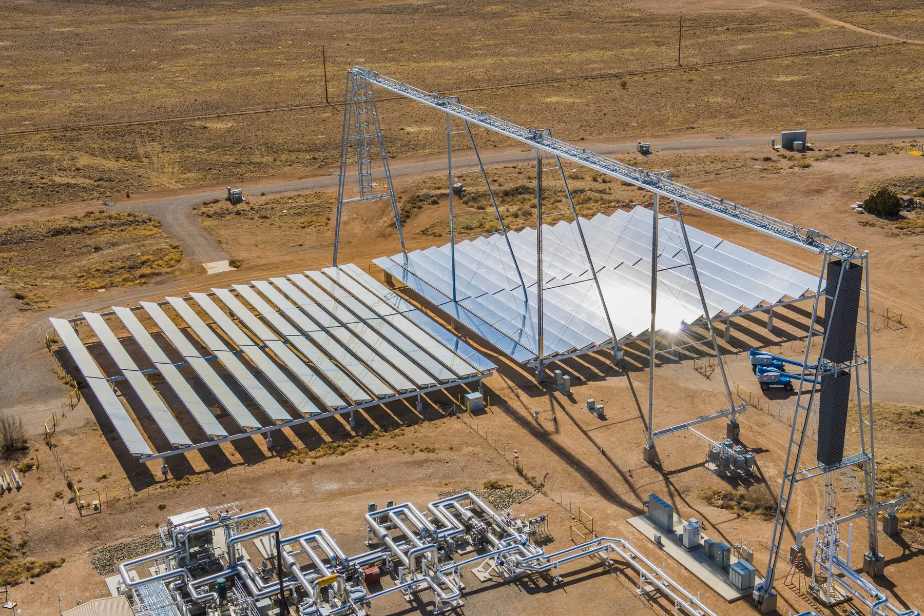 Wide desert test field view of concentrated solar hardware and receiver structures at Sandia.