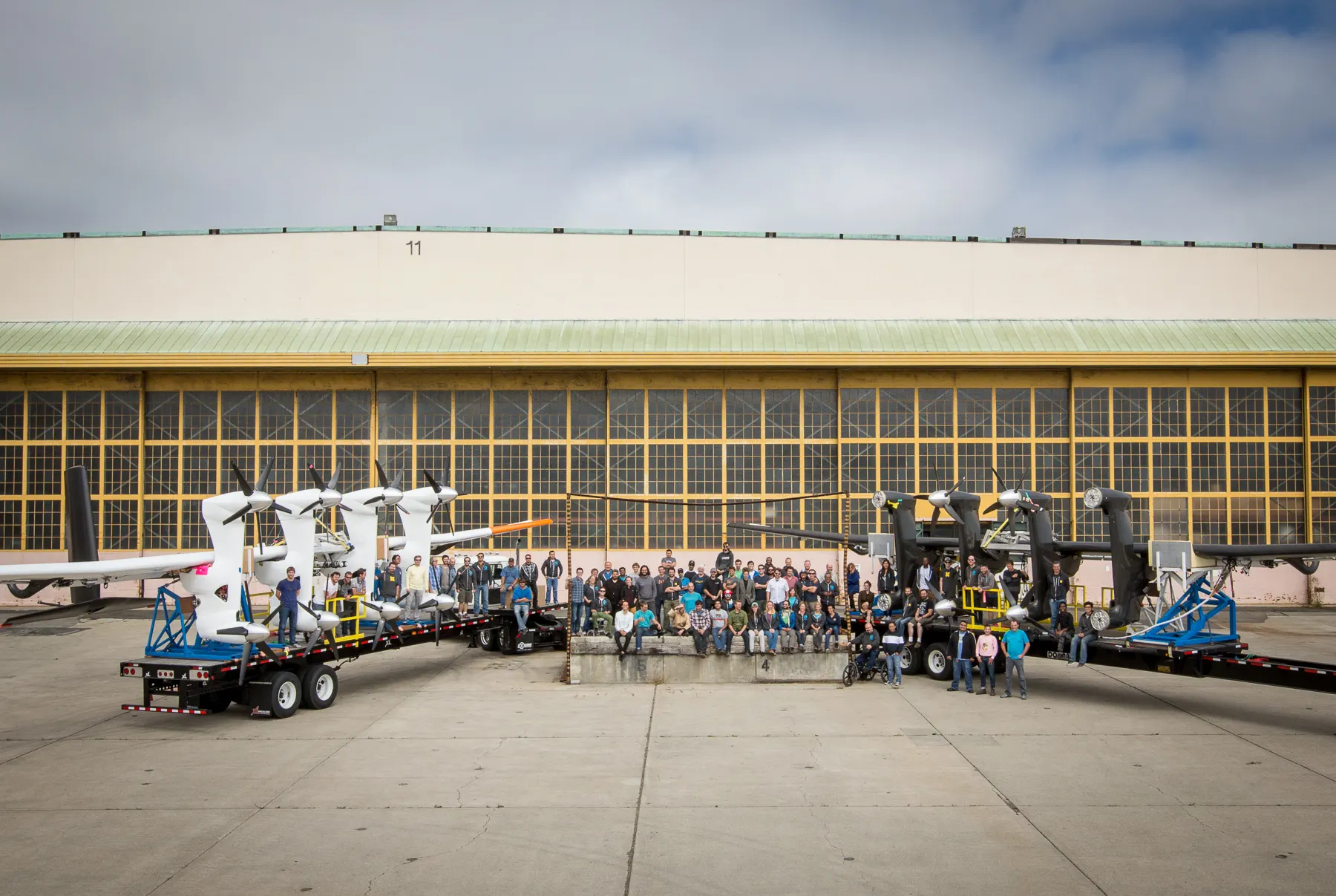 Makani aircraft and team gathered in front of a hangar.